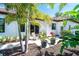 A charming backyard patio with potted plants and outdoor seating at 5 Saint John Blvd, Englewood, FL 34223