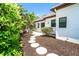 Stepping stones lead to the backyard patio and garden area at 5 Saint John Blvd, Englewood, FL 34223