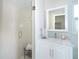 Bathroom features a modern shower with white tiles and a vanity at 5 Saint John Blvd, Englewood, FL 34223