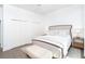 Bedroom with a comfortable bed, ceiling fan, and neutral color scheme at 5 Saint John Blvd, Englewood, FL 34223
