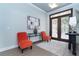 Welcoming foyer with decorative double doors, modern lighting, and stylish decor, creating an inviting ambiance at 5 Saint John Blvd, Englewood, FL 34223