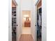 Hallway view of a vanity and access to bedroom closet space for storage at 5 Saint John Blvd, Englewood, FL 34223