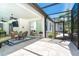 The covered lanai leads to the pool and has easy access to indoor living areas at 5 Saint John Blvd, Englewood, FL 34223