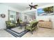 Inviting screened lanai with a seating area, view of the pool, and seamless indoor-outdoor living at 5 Saint John Blvd, Englewood, FL 34223
