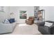 Cozy living room featuring comfortable seating, a large window with outdoor views, and a stylish bookshelf at 5 Saint John Blvd, Englewood, FL 34223