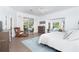 Spacious main bedroom boasts natural light, seating area, and access to the outdoors at 5 Saint John Blvd, Englewood, FL 34223