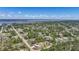 An aerial view showcases the home's location relative to the surrounding community, water and highway at 5460 Norlander Dr, Port Charlotte, FL 33981