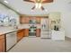 Modern kitchen with stainless steel appliances, granite countertops, and ample cabinet space at 5460 Norlander Dr, Port Charlotte, FL 33981