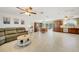Spacious living room with modern tile flooring, comfortable seating, and natural light at 5460 Norlander Dr, Port Charlotte, FL 33981