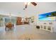 Open-concept living room seamlessly connects to a modern kitchen with stainless steel appliances at 5460 Norlander Dr, Port Charlotte, FL 33981