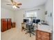 Office space with desk, shelving, and natural light at 5460 Norlander Dr, Port Charlotte, FL 33981