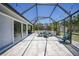 Screened patio offers outdoor dining space with backyard access and lots of natural light at 5460 Norlander Dr, Port Charlotte, FL 33981