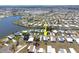 Aerial view of a home in a waterfront community with access to a lake and featuring neatly arranged residences at 6168 Partridge Ave, Englewood, FL 34224