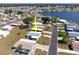 Aerial view of a neighborhood featuring homes with well-kept lawns and access to a nearby lake at 6168 Partridge Ave, Englewood, FL 34224