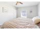 Serene bedroom features a queen bed, soft lighting, and a window at 6168 Partridge Ave, Englewood, FL 34224