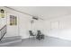 Covered patio with seating and a doorway, providing a relaxing outdoor space at 6168 Partridge Ave, Englewood, FL 34224