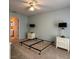 Comfortable bedroom with serene decor, carpeted floors and easy access to an en-suite bathroom at 67 Marker Rd, Rotonda West, FL 33947