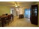 This dining room features tile floors and easy access to the kitchen and outdoor patio area at 67 Marker Rd, Rotonda West, FL 33947