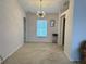 Open dining room featuring modern chandelier and a view into the kitchen at 67 Marker Rd, Rotonda West, FL 33947