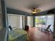 Sunroom with tile flooring, a ceiling fan, sheer curtains, and outdoor views, perfect for relaxing at 67 Marker Rd, Rotonda West, FL 33947