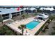 Aerial view of the condo complex showing the pool and surrounding area at 6800 Placida Rd # 227, Englewood, FL 34224
