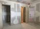 Bedroom is under construction and features multiple closets and doorways at 6800 Placida Rd # 227, Englewood, FL 34224