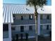 Up close shot of condo exterior showing balcony, palm trees, and building number at 6800 Placida Rd # 227, Englewood, FL 34224