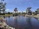Scenic pond view reflecting nearby buildings and landscaping at 6800 Placida Rd # 227, Englewood, FL 34224