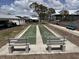 Outdoor shuffleboard court with benches, perfect for leisurely games at 6800 Placida Rd # 227, Englewood, FL 34224