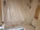 Bathroom featuring the toilet, shower, and fixtures before the renovation is complete at 6800 Placida Rd # F294, Englewood, FL 34224