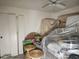 A bedroom staged with furniture covered in plastic, and featuring a ceiling fan at 6800 Placida Rd # F294, Englewood, FL 34224