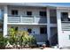 Well-maintained building with lush landscaping enhancing the community's appeal at 6800 Placida Rd # F294, Englewood, FL 34224
