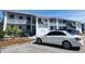 Well-maintained building exterior with parking available for residents and visitors alike at 6800 Placida Rd # F294, Englewood, FL 34224