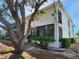 View of the exterior side of the building featuring a large screened-in lanai at 6800 Placida Rd # F294, Englewood, FL 34224