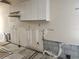 Kitchen being remodeled; upper cabinets remain with missing lower cabinets and exposed walls at 6800 Placida Rd # F294, Englewood, FL 34224
