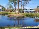 Picturesque pond with fountain feature, enhancing the community's serene atmosphere at 6800 Placida Rd # F294, Englewood, FL 34224