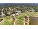 Aerial view of a sprawling golf course and nearby community homes at 7360 David Blvd, Port Charlotte, FL 33981