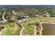 Aerial view of a sprawling golf course and nearby community homes at 7360 David Blvd, Port Charlotte, FL 33981