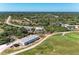This aerial shot shows the golf course and nearby community homes at 7360 David Blvd, Port Charlotte, FL 33981