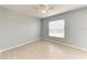 Bedroom featuring tile flooring, fan, and a window with views of outdoors at 7360 David Blvd, Port Charlotte, FL 33981