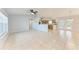 Spacious living room showcasing tile flooring, an open layout, and natural light at 7360 David Blvd, Port Charlotte, FL 33981
