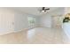 The living room is adjacent to a bathroom at 7360 David Blvd, Port Charlotte, FL 33981