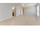 Large main bedroom with tile floors, ceiling fan, and ensuite bathroom at 7360 David Blvd, Port Charlotte, FL 33981