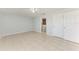 Spacious bedroom with tile floors, ceiling fan, and ensuite bathroom access at 7360 David Blvd, Port Charlotte, FL 33981