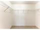 A walk-in closet with white walls, tile floors and wire shelving at 7360 David Blvd, Port Charlotte, FL 33981