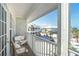 This covered balcony has nice seating and views of the property with lush tropical vegetation and sand at 7536 Palm Island S Dr # 1522, Placida, FL 33946