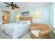 Charming bedroom with wicker accents, featuring a cozy armchair and calming wall colors for a serene retreat at 7536 Palm Island S Dr # 1522, Placida, FL 33946
