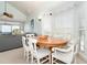 Comfortable dining area featuring an oval table, seating for six and a view of the living area at 7536 Palm Island S Dr # 1522, Placida, FL 33946
