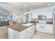 Open-concept kitchen with island flowing into the dining and living areas, great for entertaining at 7536 Palm Island S Dr # 1522, Placida, FL 33946