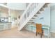 Inviting living area with kitchen, stairway, and decoratively appointed desk at 7536 Palm Island S Dr # 1522, Placida, FL 33946